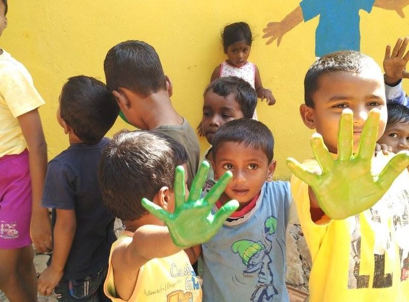 kids with paint on hands