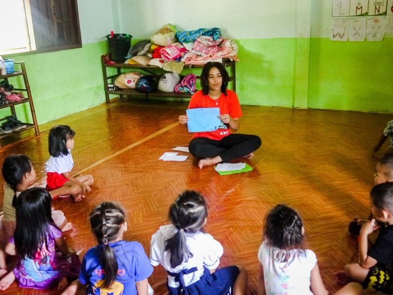 Participant teaching basic words in English to kids